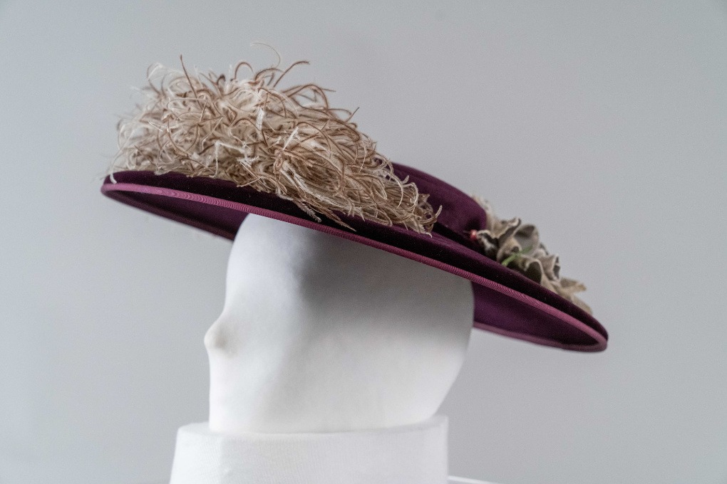 Photo of Dark Purple Velvet and Felt Cartwheel Hat with White Ostrich Feather