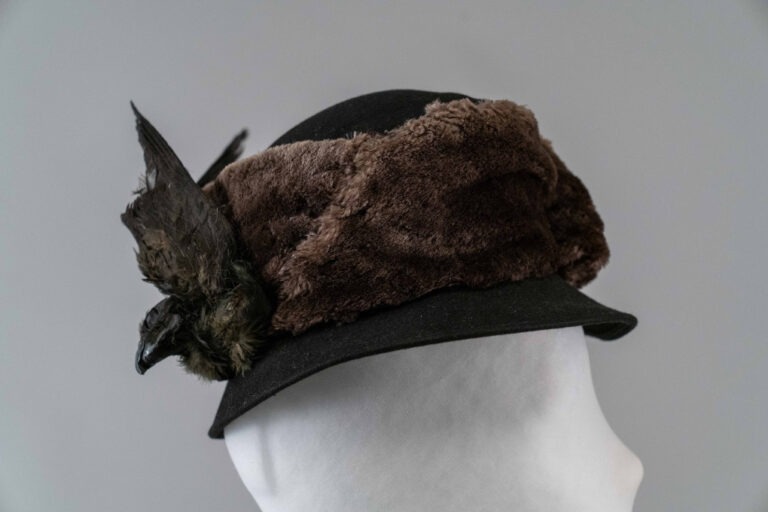Photo of Black High Chapeau trimmed with Brown Fur and a Bird