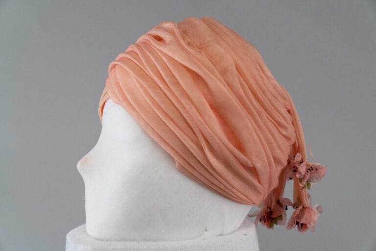 Photo of Pink Organza Draped Turban with Streamers and Flowers