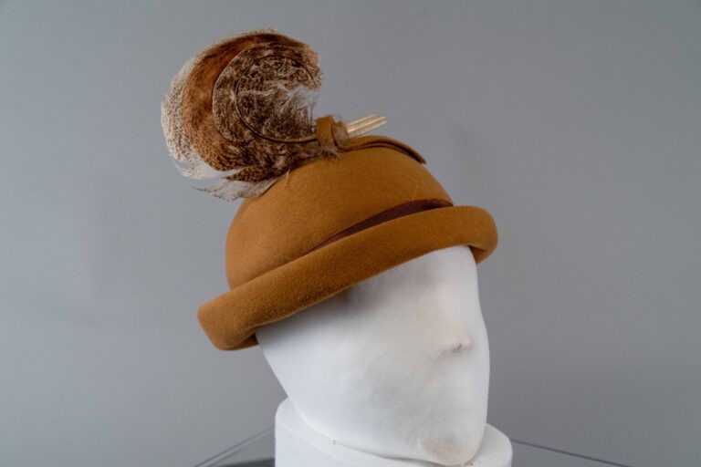 Photo of Camel Colored Rolled Brim Bowler with Curled Turkey Feather Trim